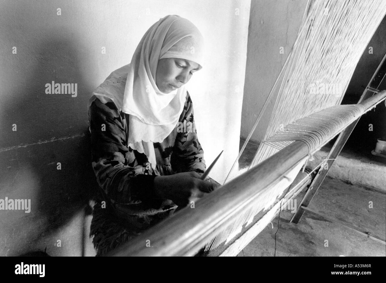 Painet ha1374 183 black and white clabor woman weaving loom magdi tunisia country developing nation less economically Stock Photo