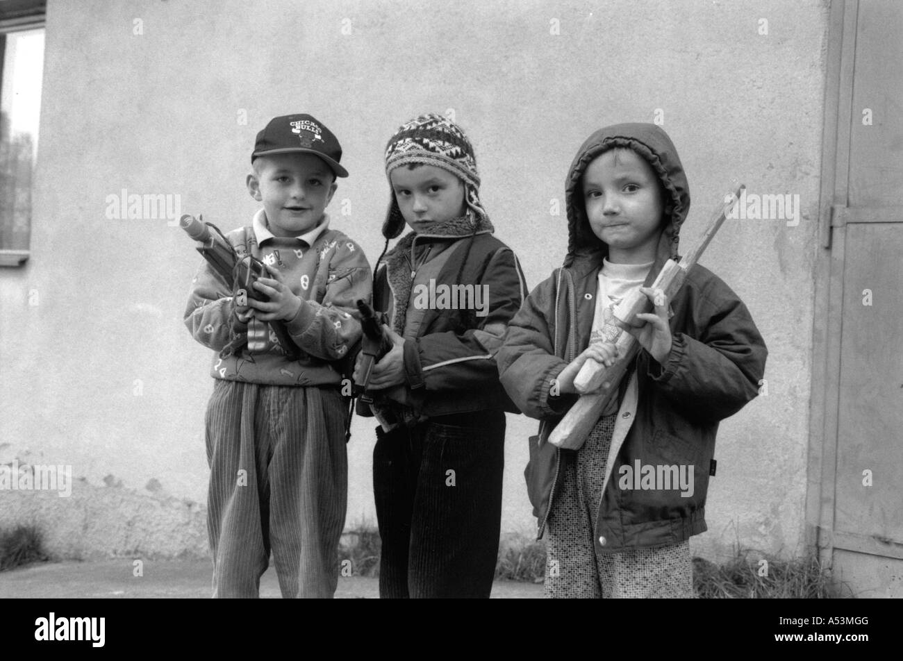 Painet ha1410 235 black and white war bosnian refugee children boys guns gun boy czech republic country developing nation Stock Photo