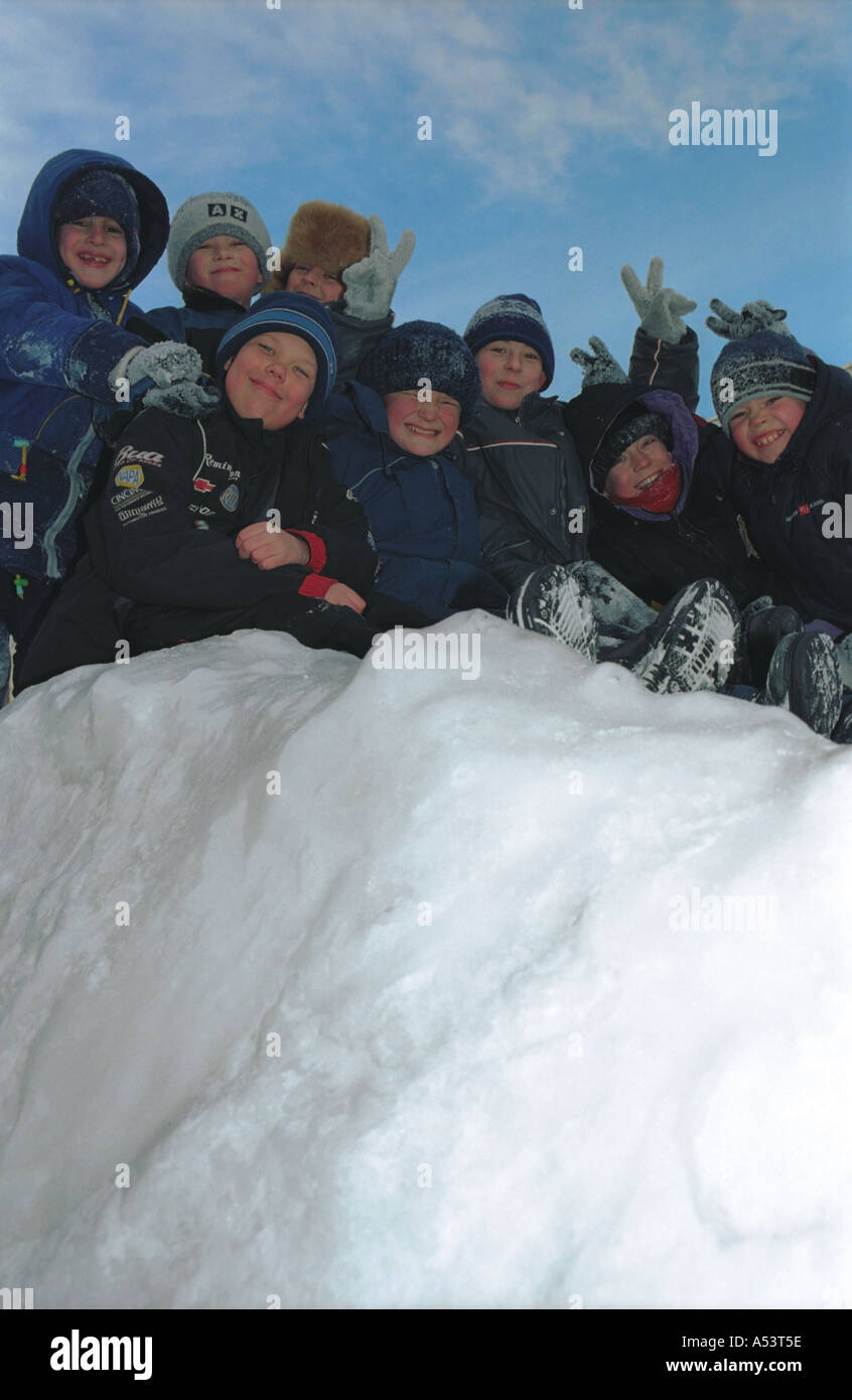 Children on a slider board Altai Siberia Russia Stock Photo