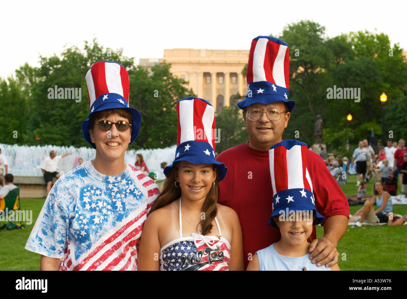 ILLINOIS Springfield Family with two daughters where tall red white and blue hats Fourth of July outdoor concert Stock Photo