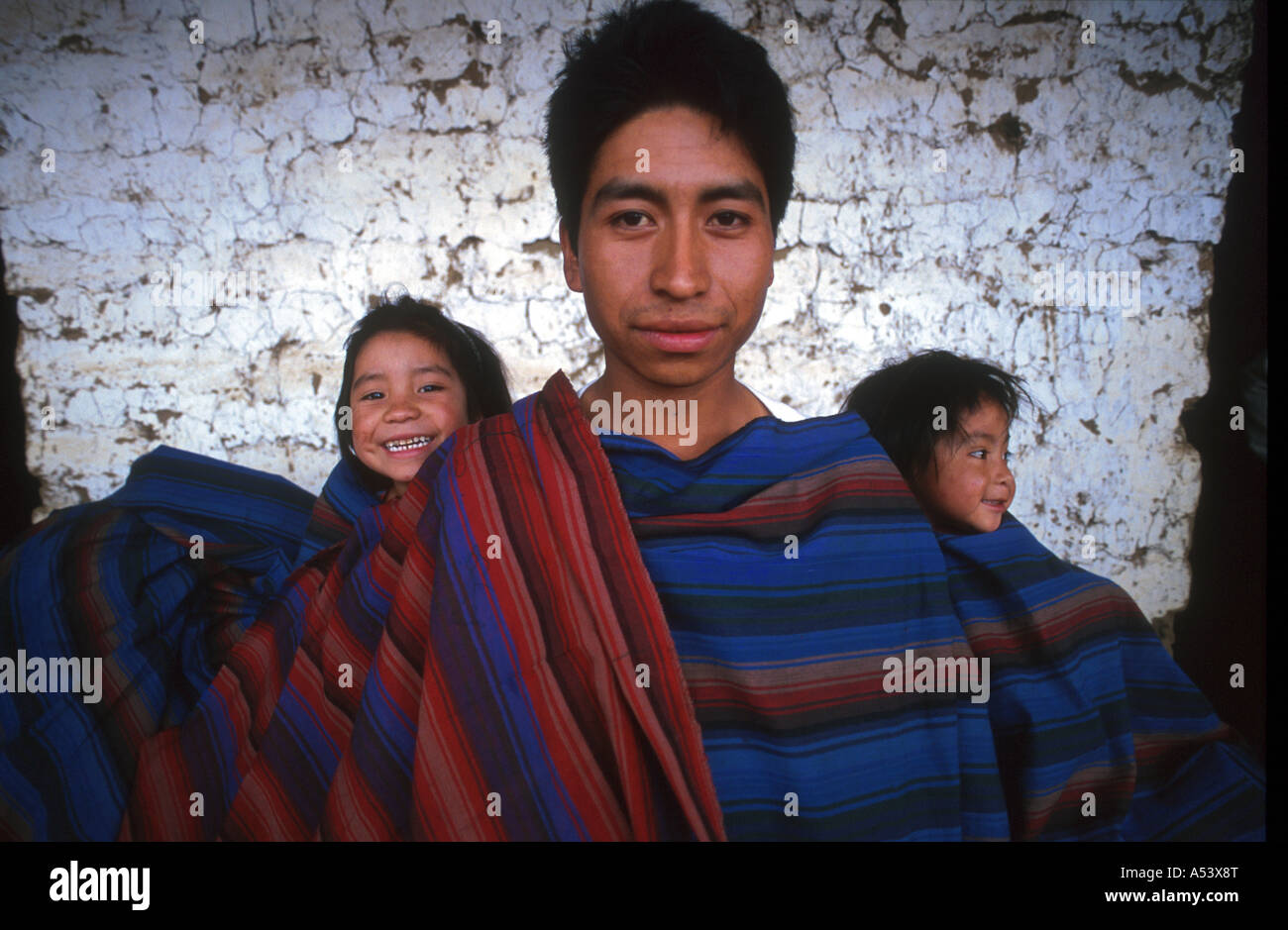 Painet ha2266 5069 man guatemala children weaving sample cloth wrapping quetzaltenango country developing nation less Stock Photo