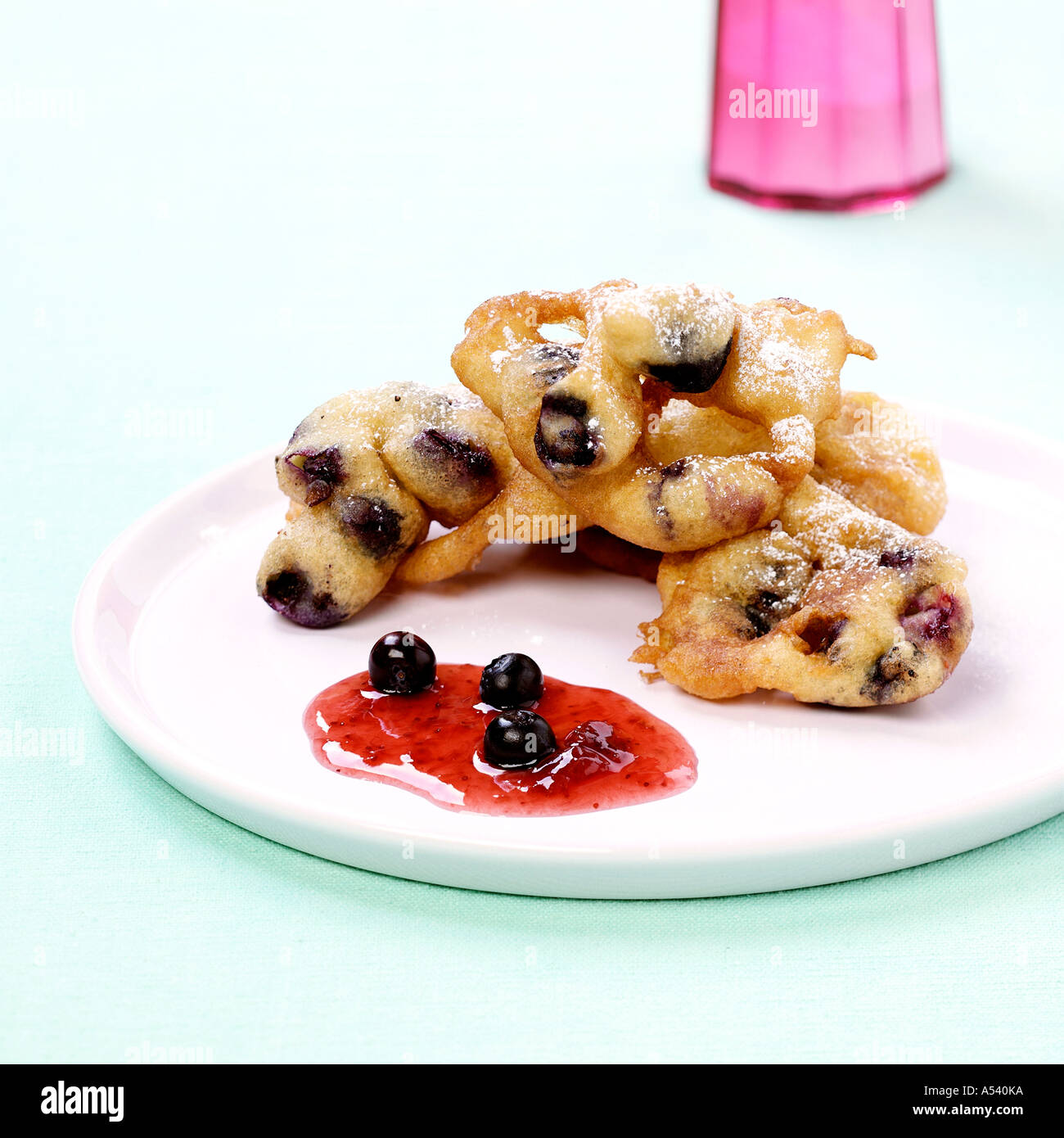 Deep fried pastries with blueberries Stock Photo Alamy