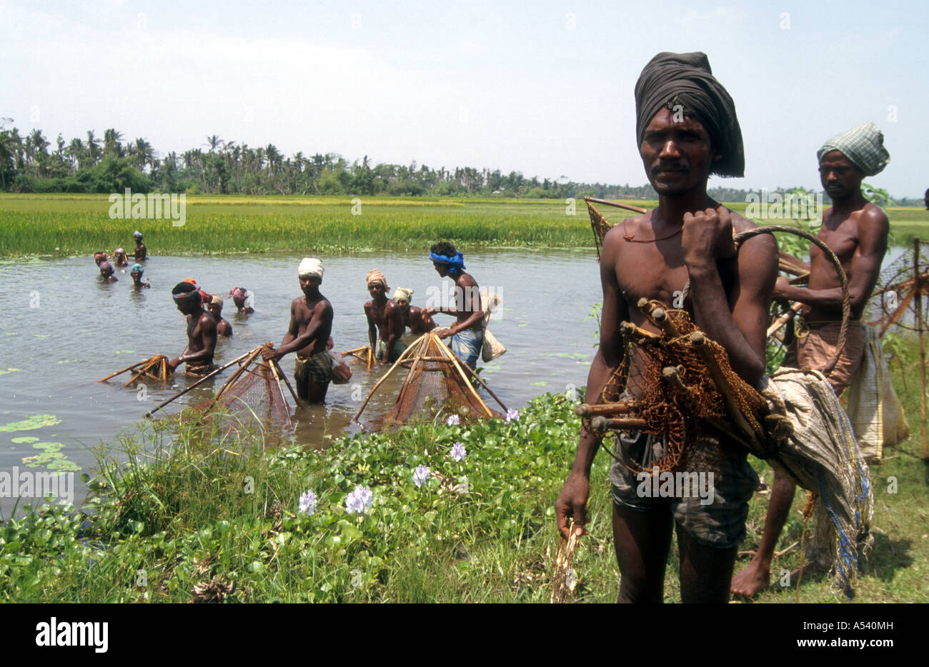 Painet ha2398 5223 india fsihing men fishing river orissa country developing nation economically developed culture emerging Stock Photo