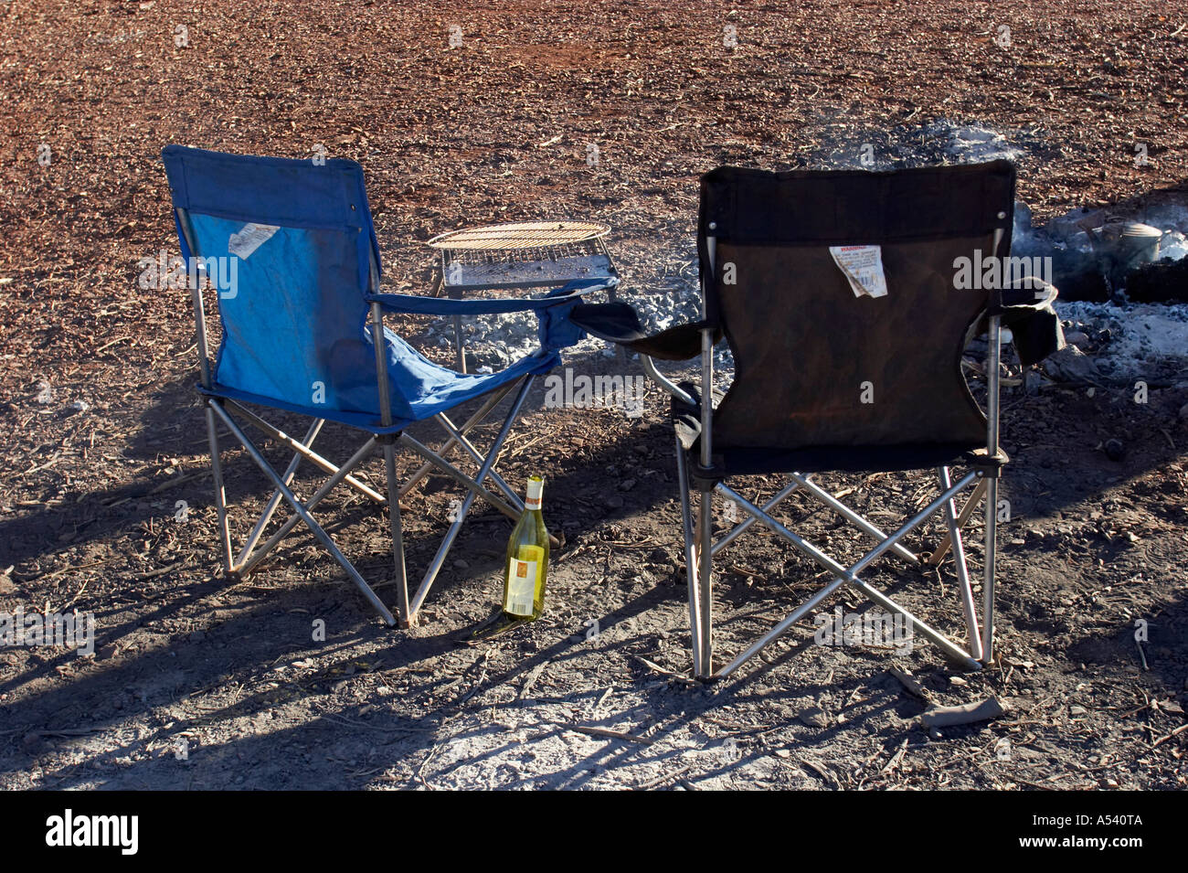Two Camping Chairs And An Empty Bottle Wine Stock Photo Alamy
