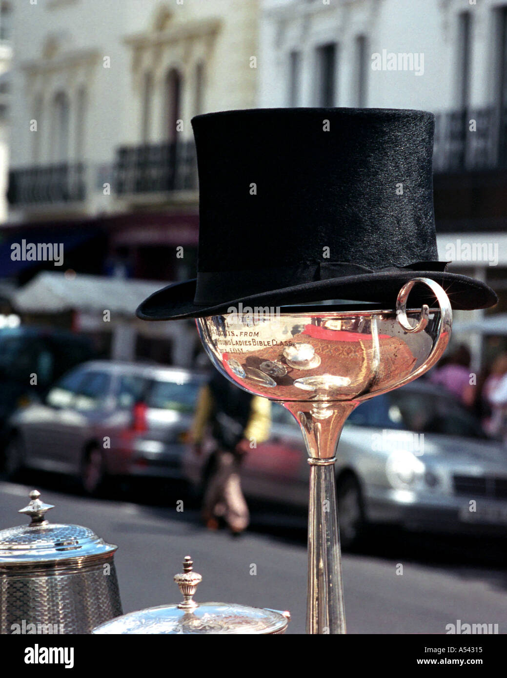 Top hat and silver cup Portobello Road street market London Stock Photo Alamy