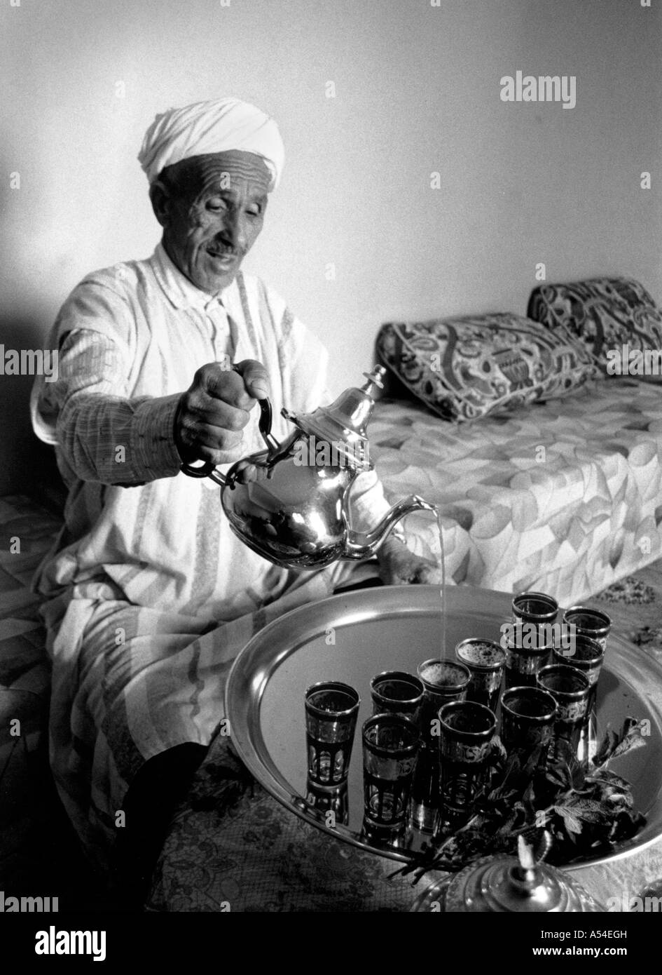 Painet hn2006 651 black and white food man pouring mint tea tiznit morocco country developing nation less economically Stock Photo