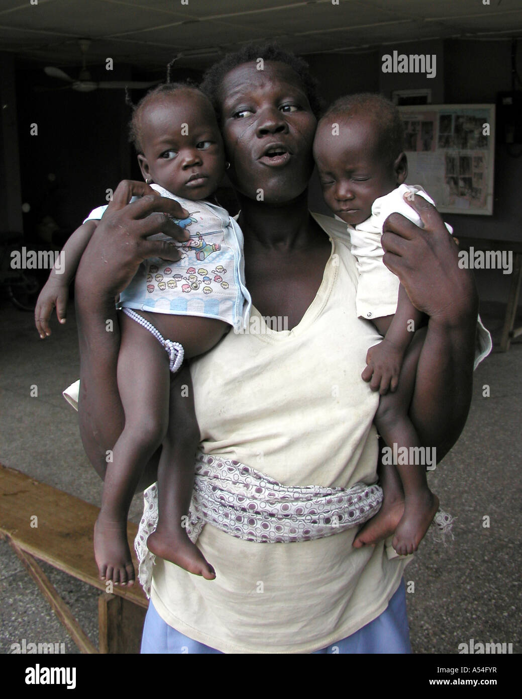 Painet hn2245 7827 ghana woman twins bolgatanga country developing nation less economically developed culture emerging Stock Photo