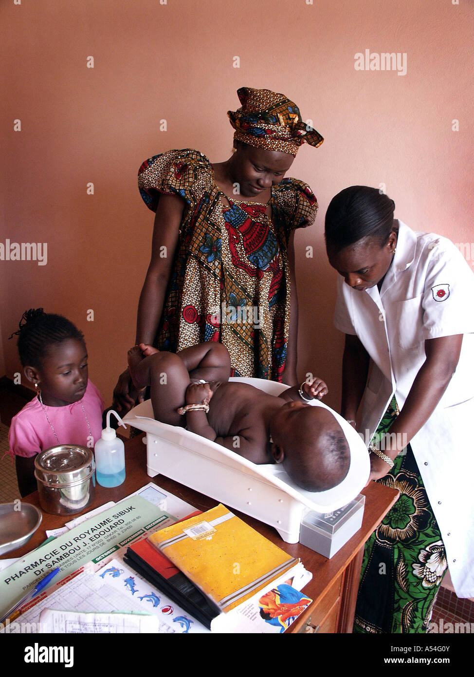 Painet hn2261 7850 senegal woman weighing baby routine clinic sida service  cnter dakar country developing nation less Stock Photo - Alamy