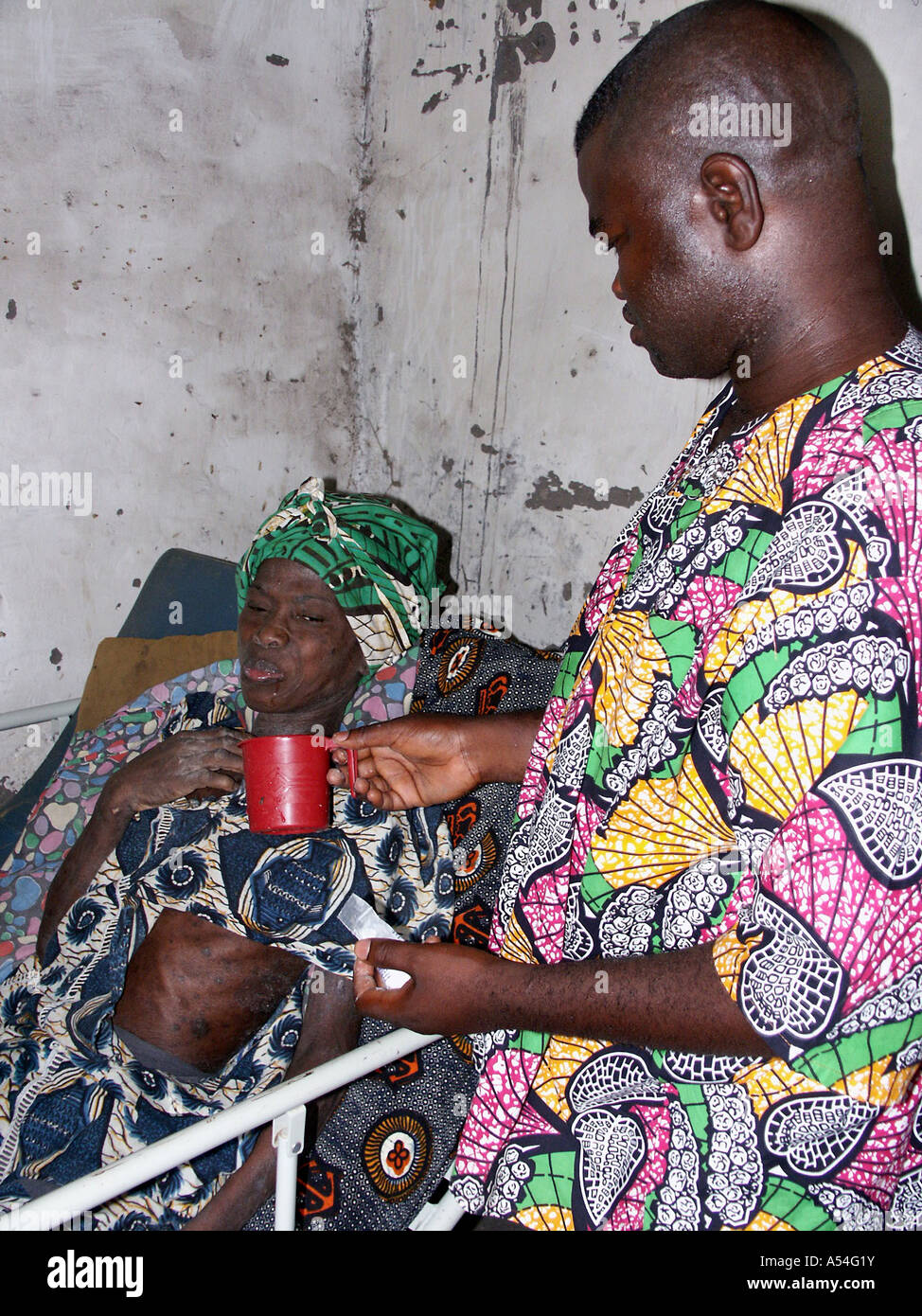 Painet hn2273 7887 gambia aids victim monica cared for by nurse saidyba taba birkama country developing nation less Stock Photo
