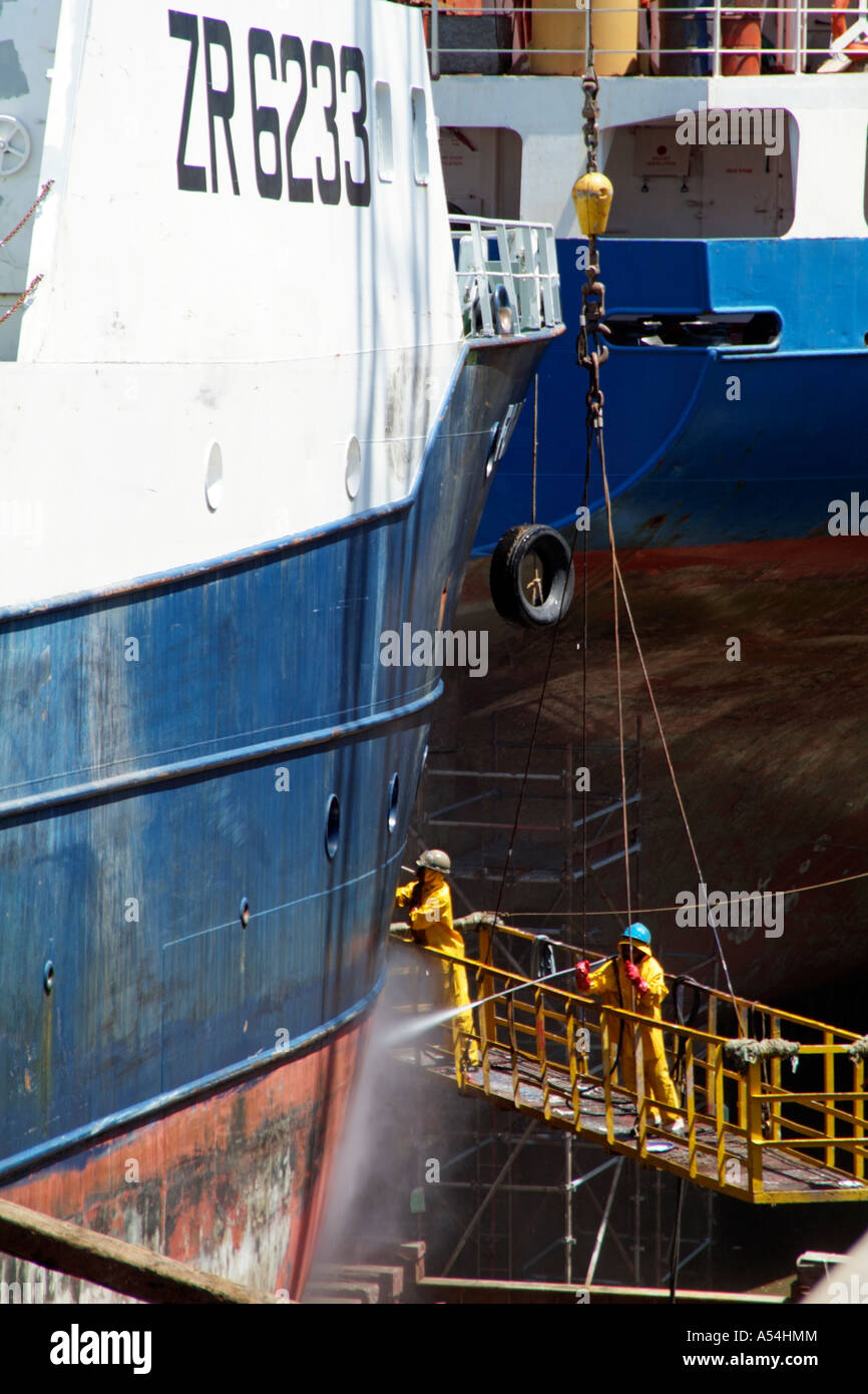Dry dock port of Cape Town South Africa RSA. Cleaning hull of ship