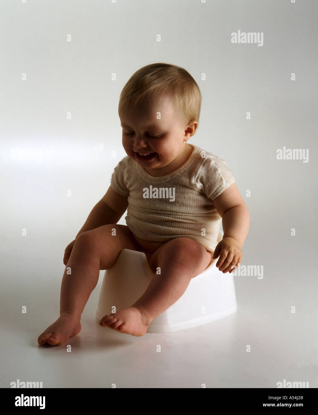 toddler-on-potty-stock-photo-alamy