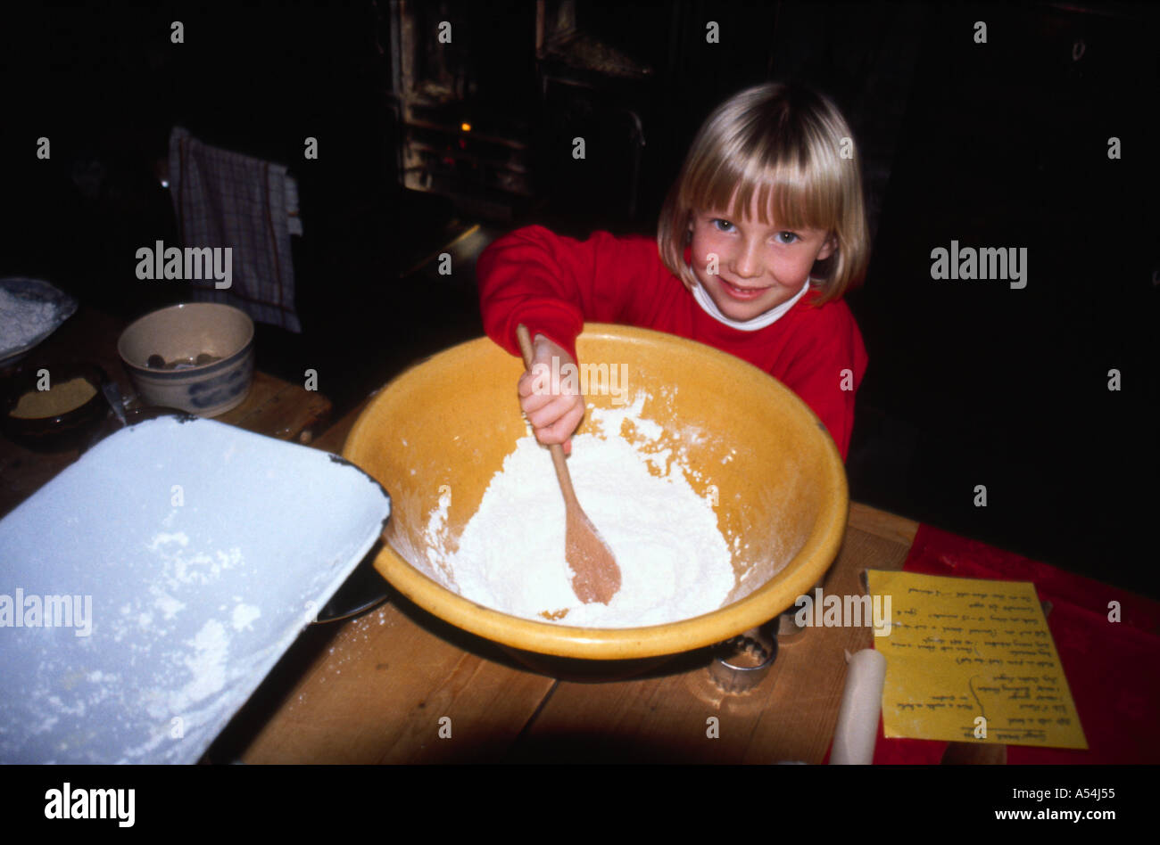 Girl helping with baking Stock Photo