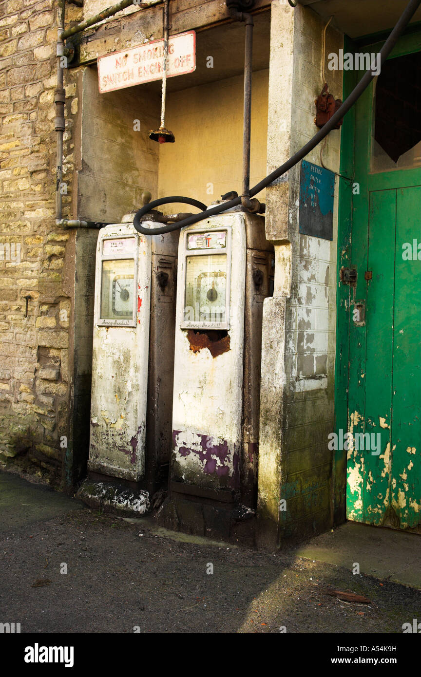 Old petrol pumps at garage in Marshfield Cotswolds Avon Stock Photo