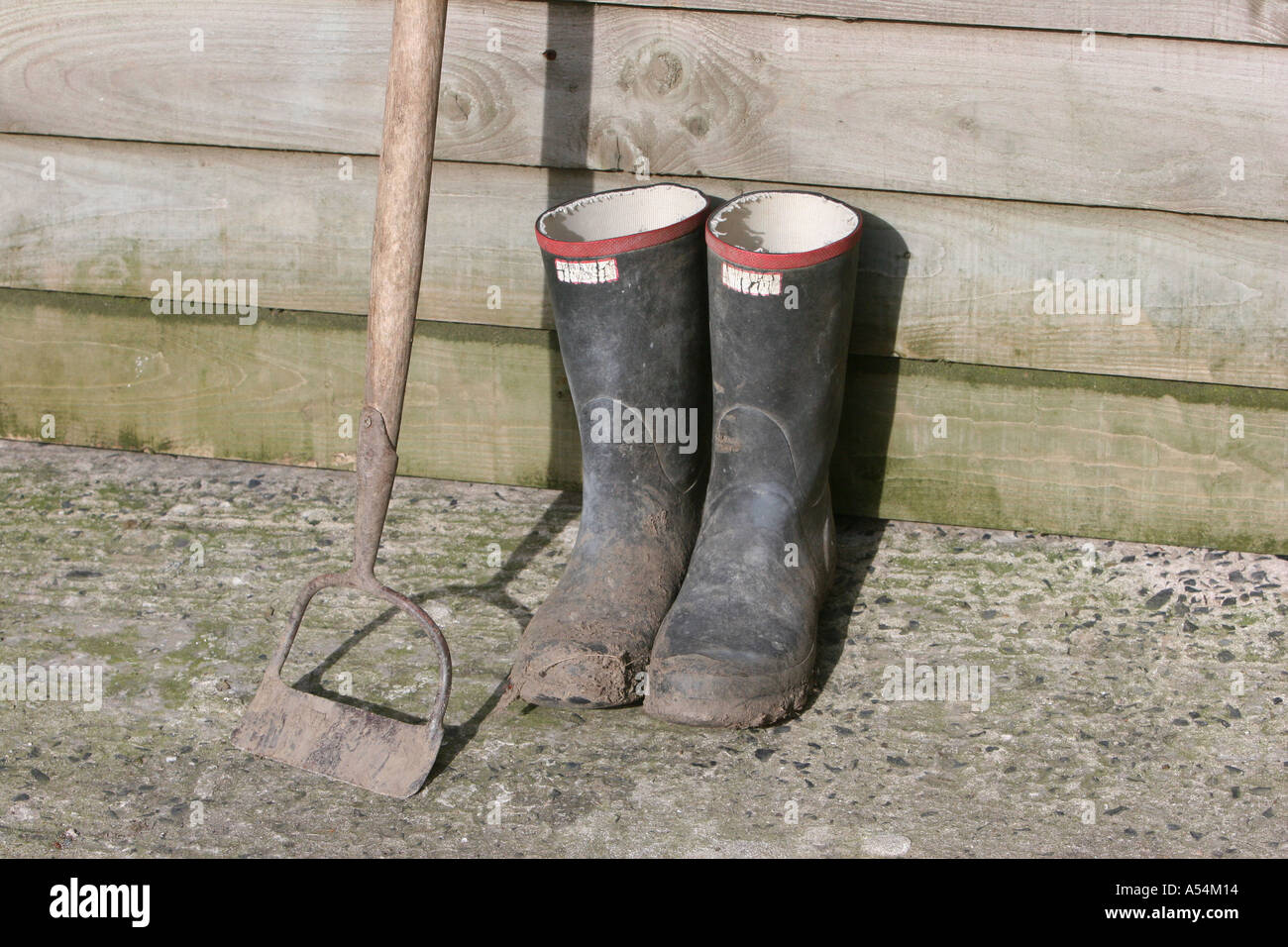 Boots and Hoe Stock Photo