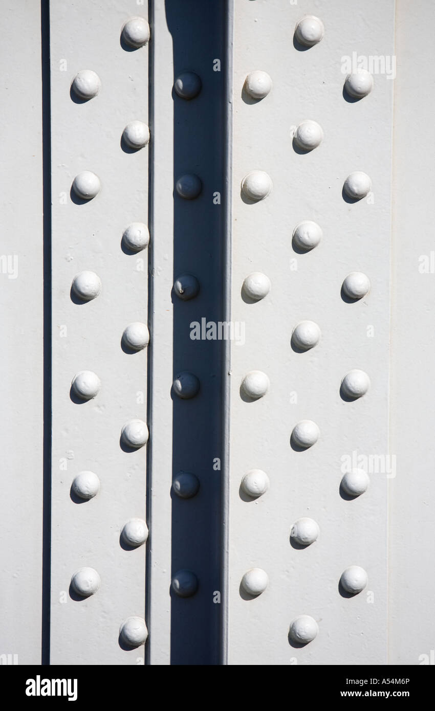 Rivet heads in a railroad bridge steel girder structure Stock Photo