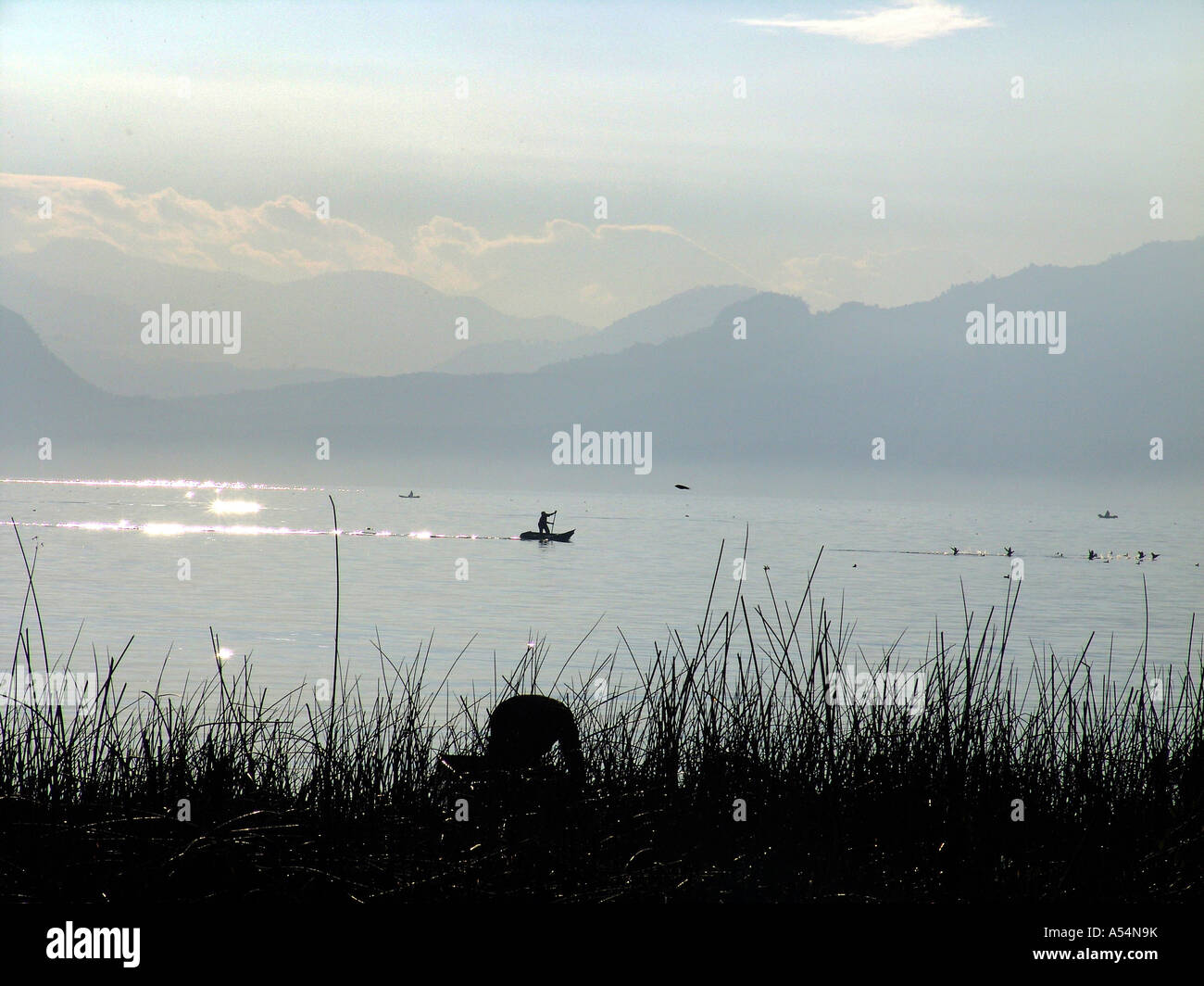 Painet ip1679 guatemala men fishing lake atitlan country developing