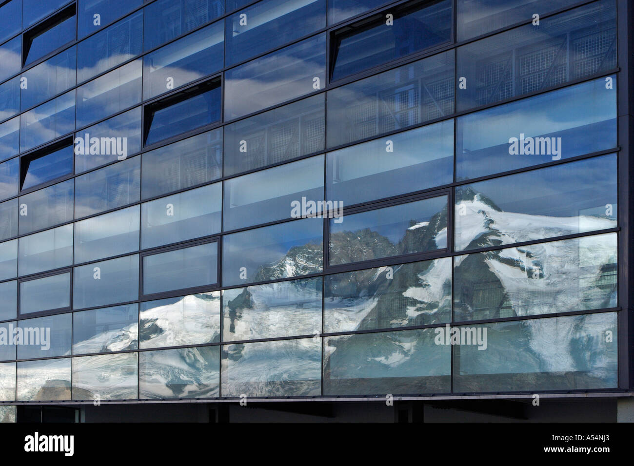 Reflection of mountain Großglockner on glass front of parking house on Franz Josefs Höhe Carinthia Austria Stock Photo
