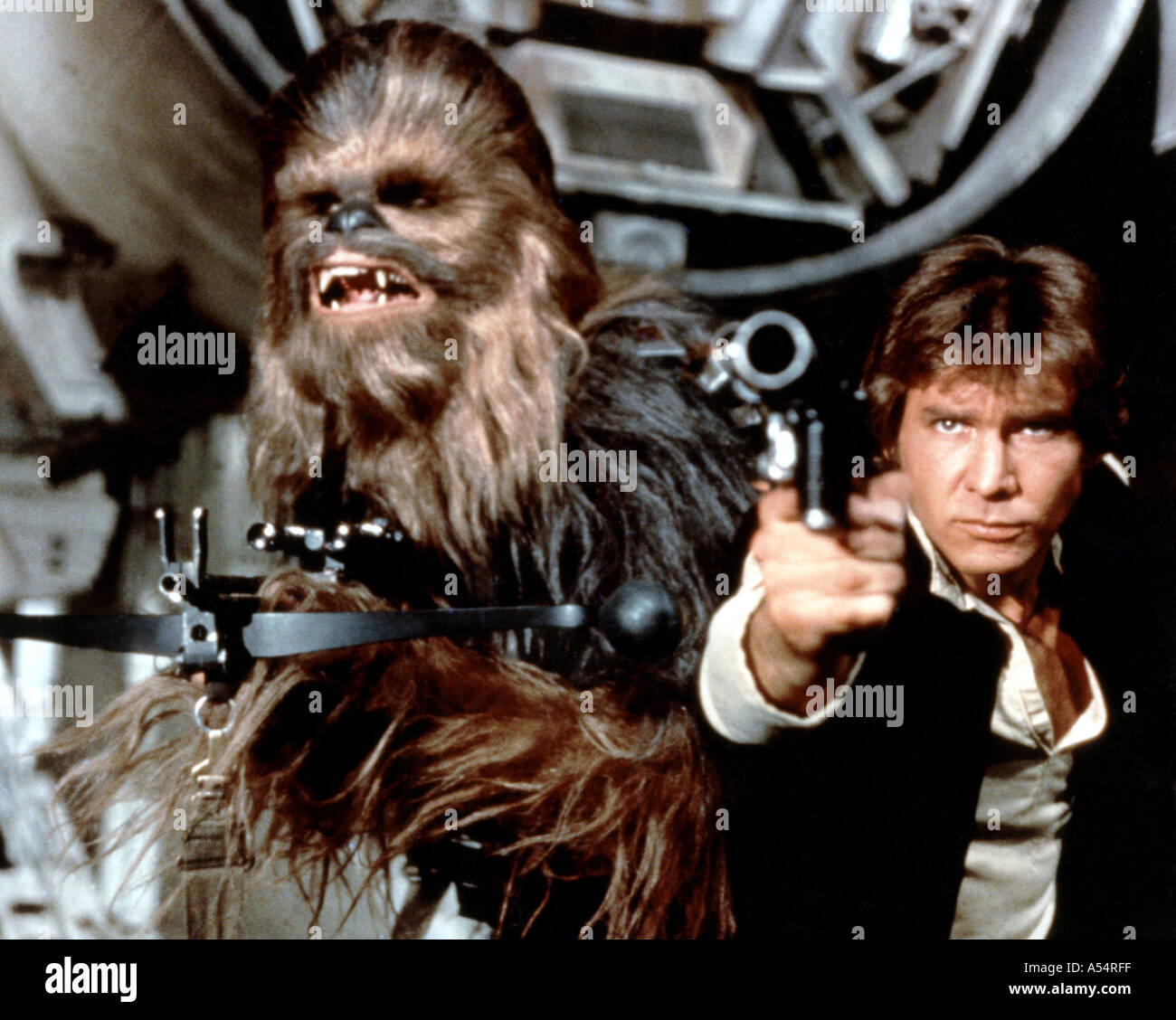 STAR WARS 1977 film starring l r Peter Mayhew as Chewbacca and Harrison Ford as Han Solo Stock Photo