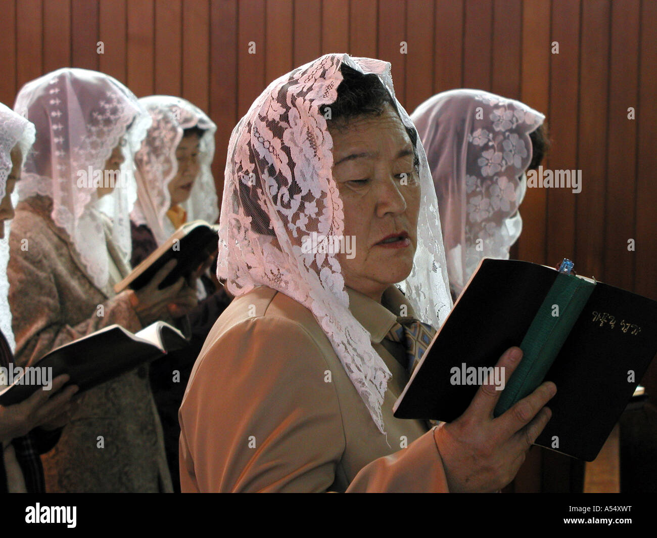 Painet ip2165 women head scarf shawl korea catholic mass seoul 2003 country  developing nation less economically developed Stock Photo - Alamy