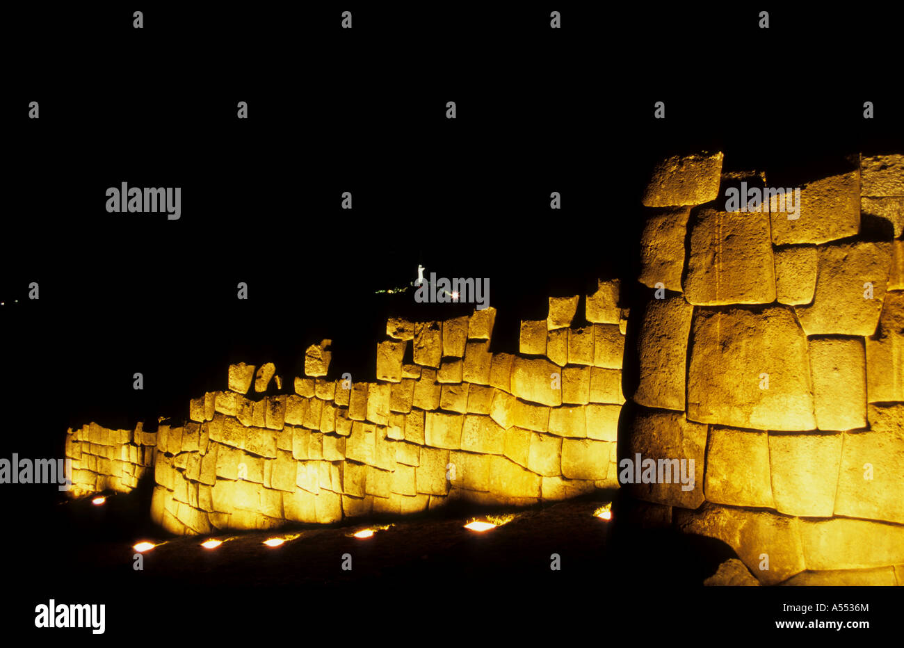 Inca wall lit up at night, Sacsayhuaman, Cusco, Peru Stock Photo