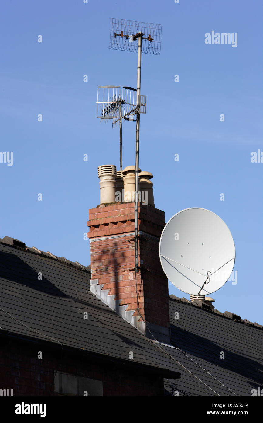 Chimney with TV aerials and satellite dish Stock Photo Alamy