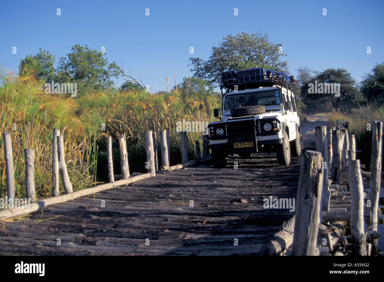Land Rover Is Driving Over A Wooden Bridge At Third Bridge Safari 