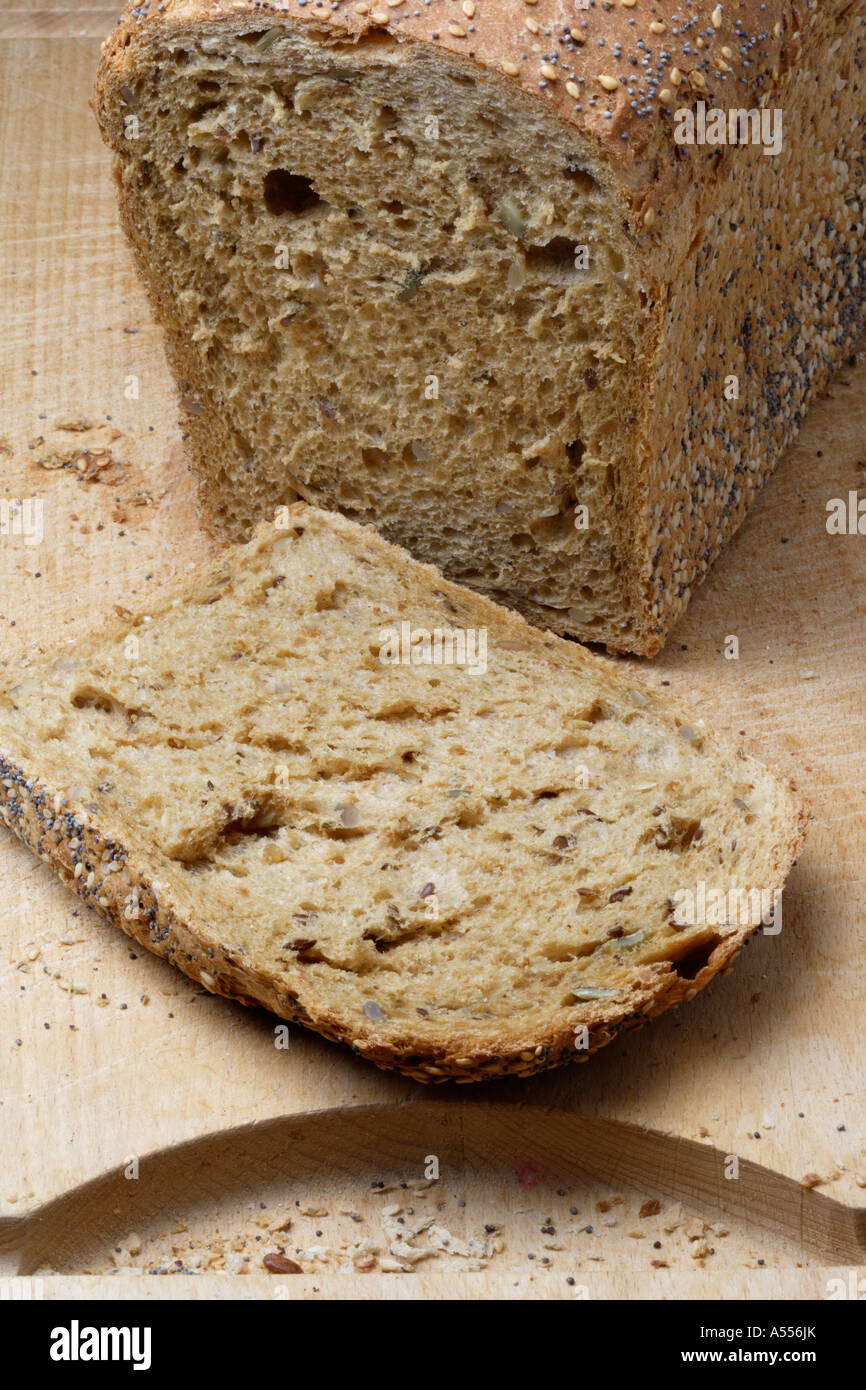 Wholemeal Loaf on breadboard Stock Photo