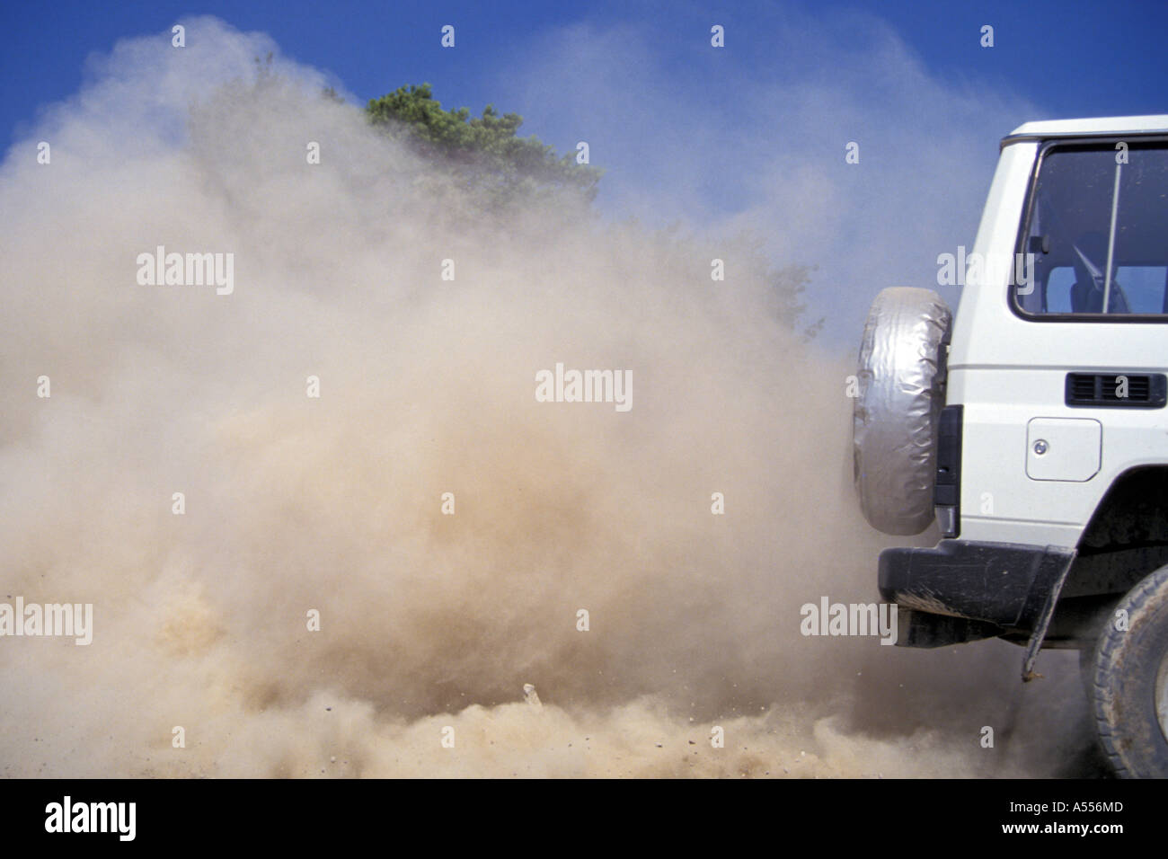 Offroad vehicle with dust behind the car Stock Photo Alamy