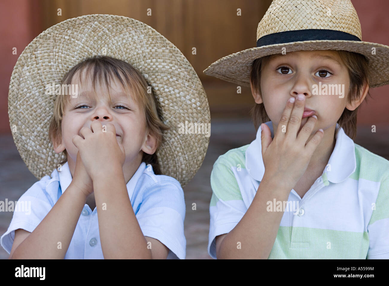 Two boys wearing panama hats Stock Photo Alamy