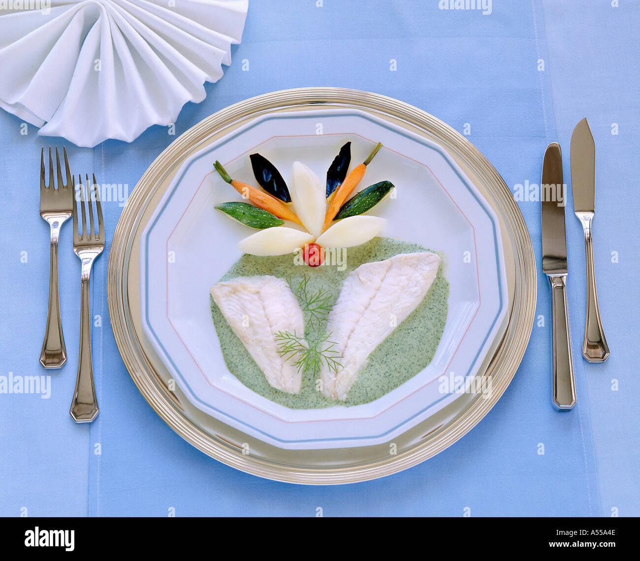 plate with PLAICE fish fillet starter or main setting elegance table luxury Stock Photo