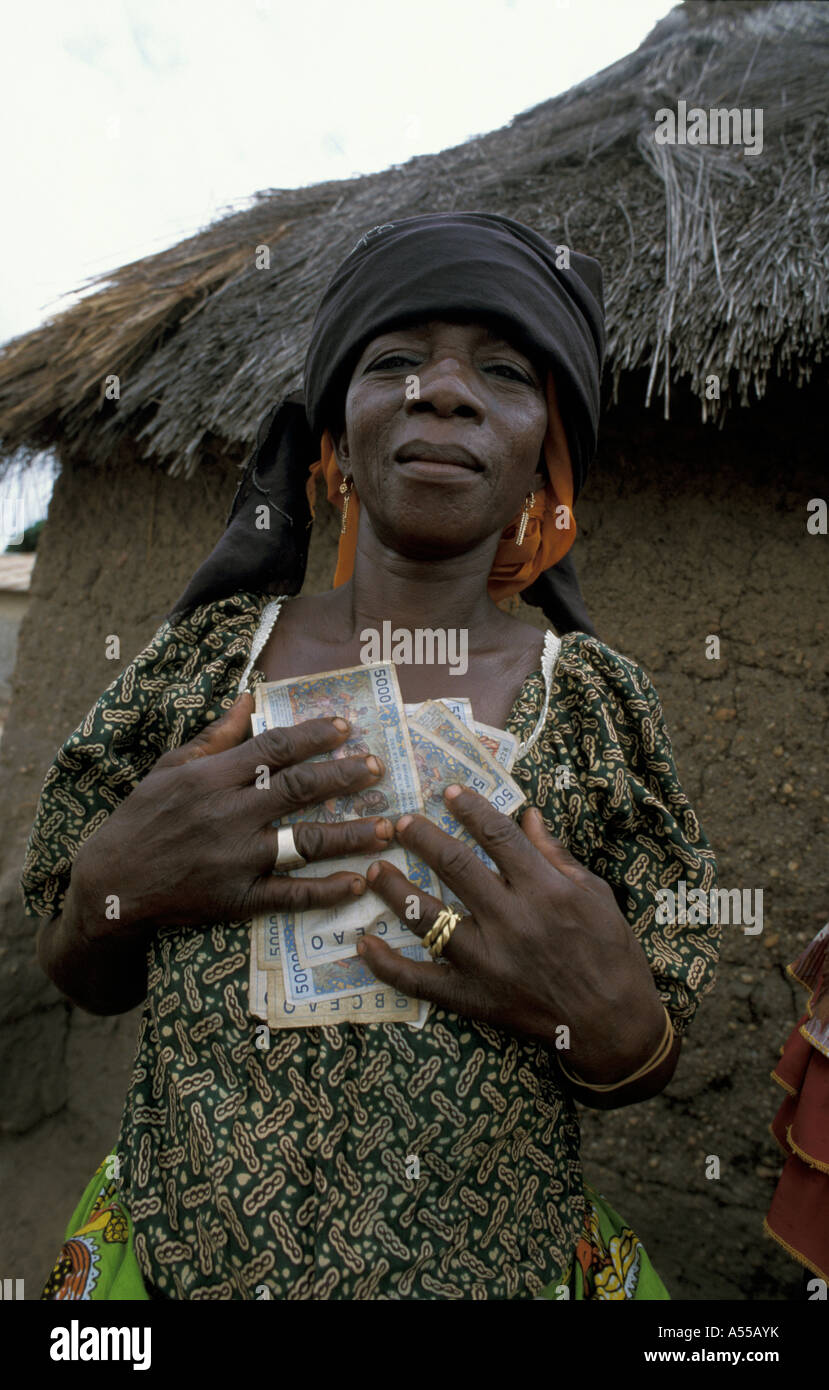 Painet ik0219 benin beneficiary microcredit savings club holding money taken loan bembereke country developing nation less Stock Photo