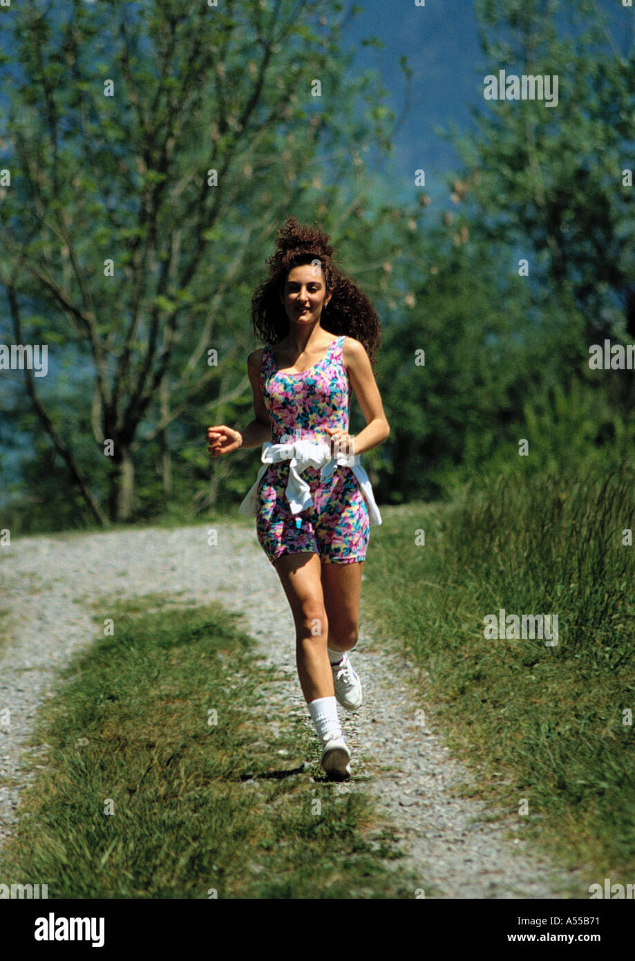 young woman jogging in the countryside Stock Photo