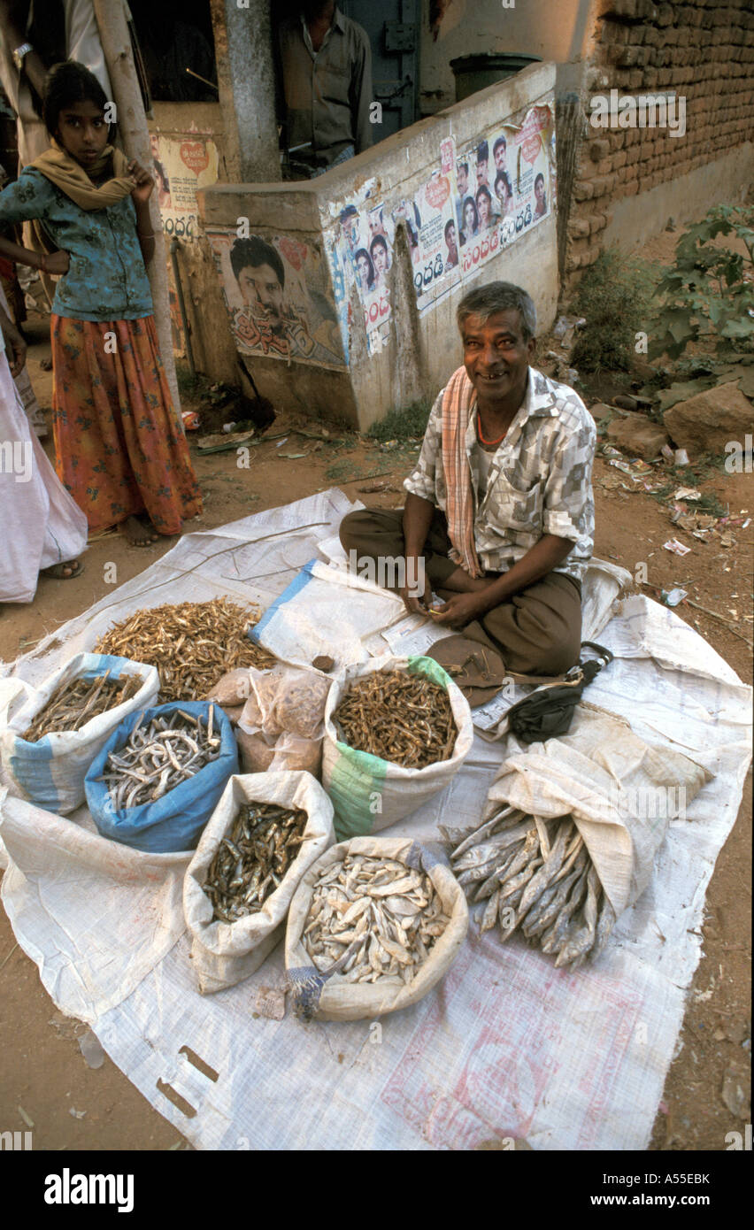 ik0424 india man selling dried fish village market madurai tamil