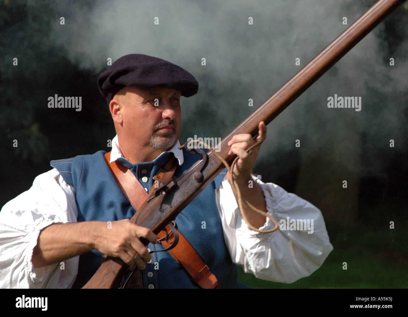 Soldier firing old pistol at re-enactment show Stock Photo