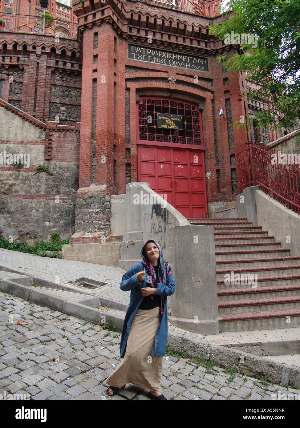 Painet is1600 turkey woman standing front entrance megale or greek high school built 1881 for students istanbul country Stock Photo