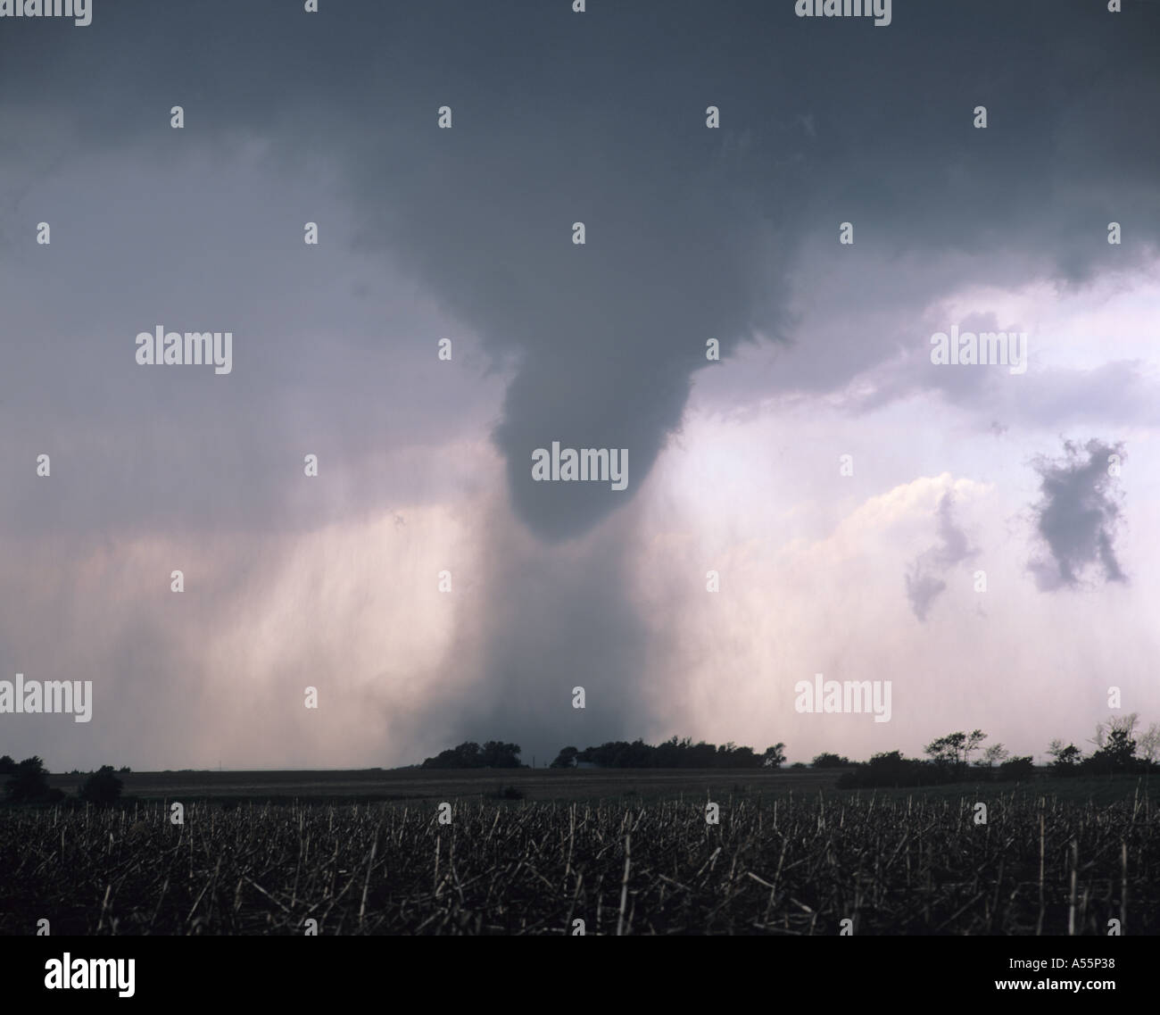 A large black dusty tornado touches down over farmland in Nebraska, USA Stock Photo