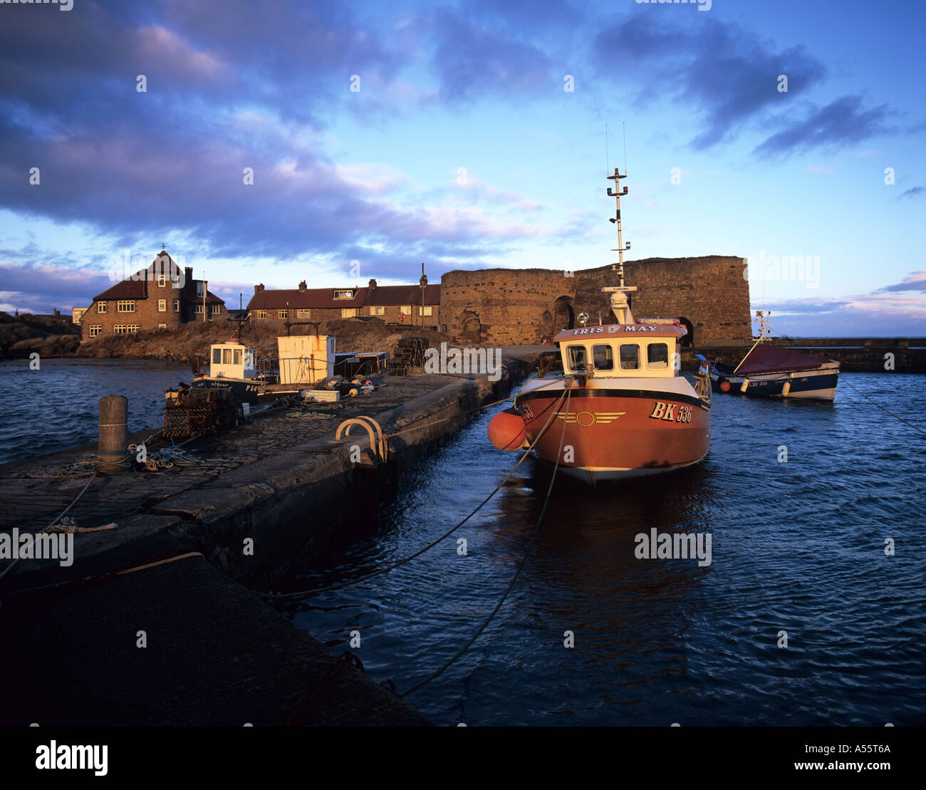 Beadnell Harbour on the coast of Northumberland, England, at sunset Stock Photo