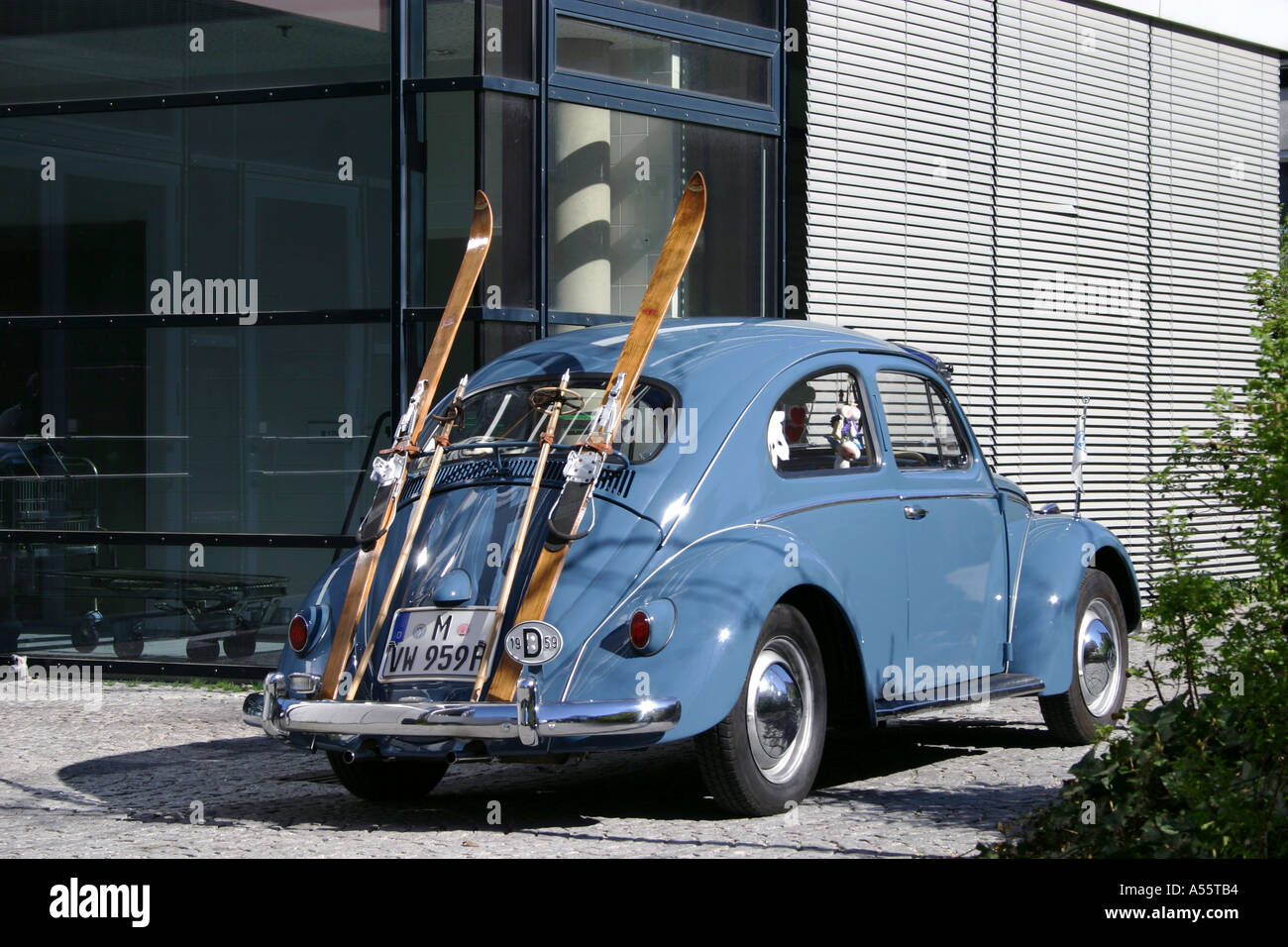 A Volkswagen 1959 beetle car with oldfashioned snow ski seen in Munich Bavaria Germany Stock Photo