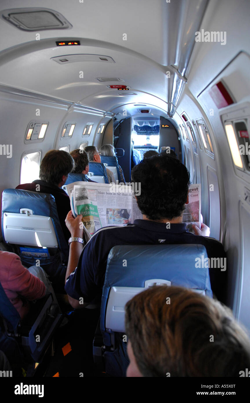 Airline passengers on Air New Zealand Beech1900D commuter aircraft during flight, February 2007 Stock Photo
