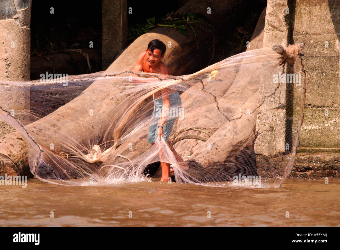 Vietnamese throwing fishing net Stock Photo Alamy