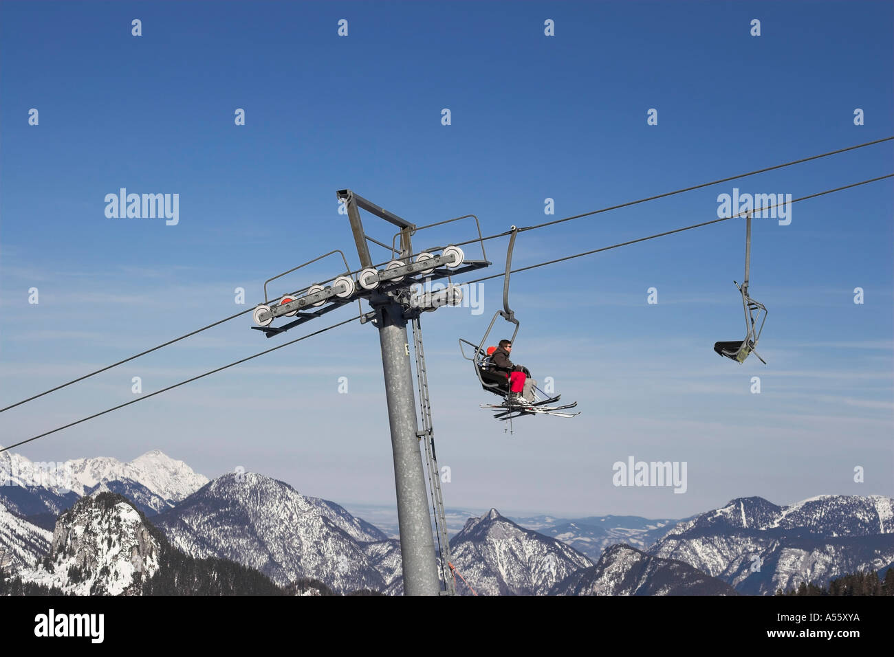 Skiers in a chair lift Stock Photo - Alamy