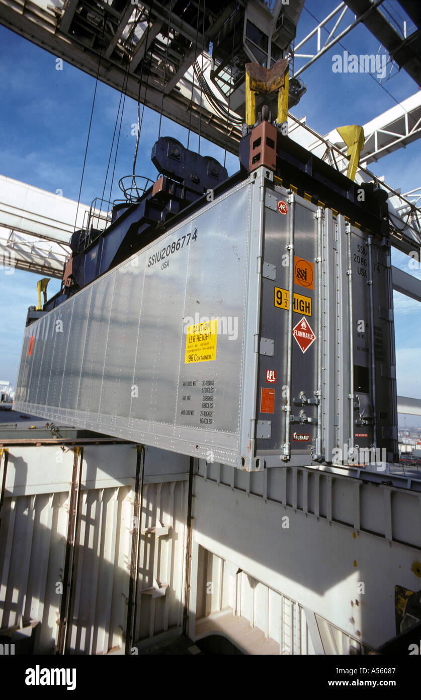 shipping container being loaded on ship at Port of Oakland California Stock Photo