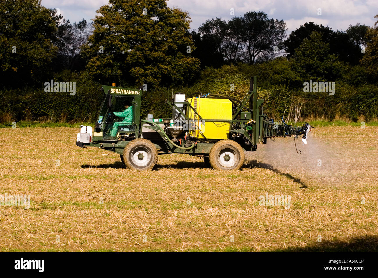 Spraying weedkiller on a field of stubbles to kill it off ready for