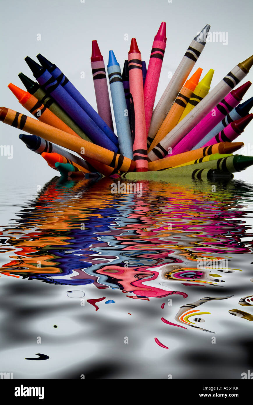 crayons in liquid pool Stock Photo