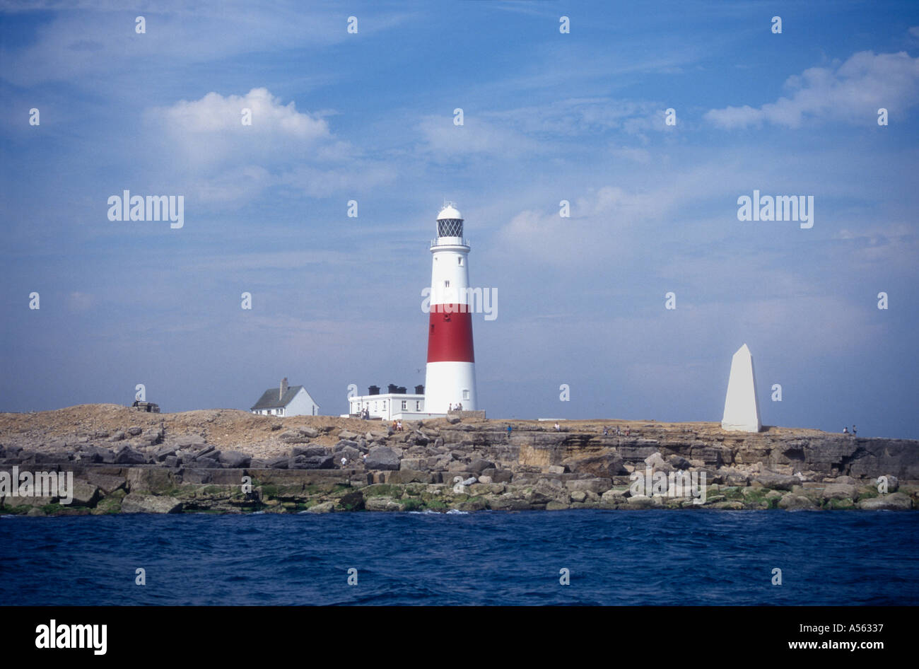 The lighthouse built 1905 and the Trinity house navigation obelisk at Portland Bill Dorset Engalnd UK Stock Photo