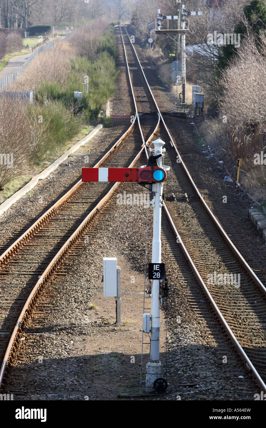 red rail signal with train tracks in background showing points Stock ...