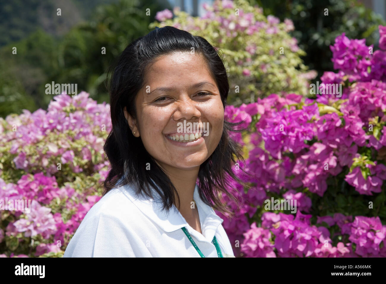 Thai young female tourist tour guide in botanic gardens Krabi Province, Southern Thailand Stock Photo