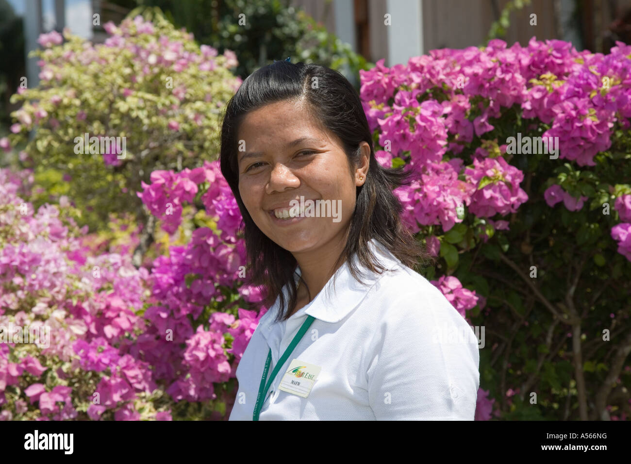 Thai young female tourist tour guide in botanic gardens Krabi Province, Southern Thailand - Flora and Fauna Stock Photo