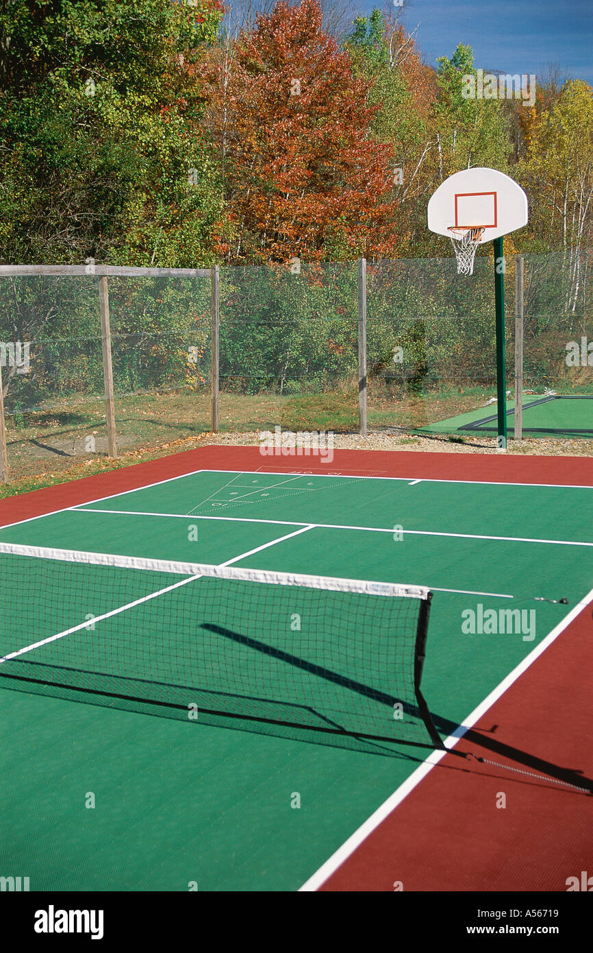Tennis court with basketball hoop Stock Photo Alamy