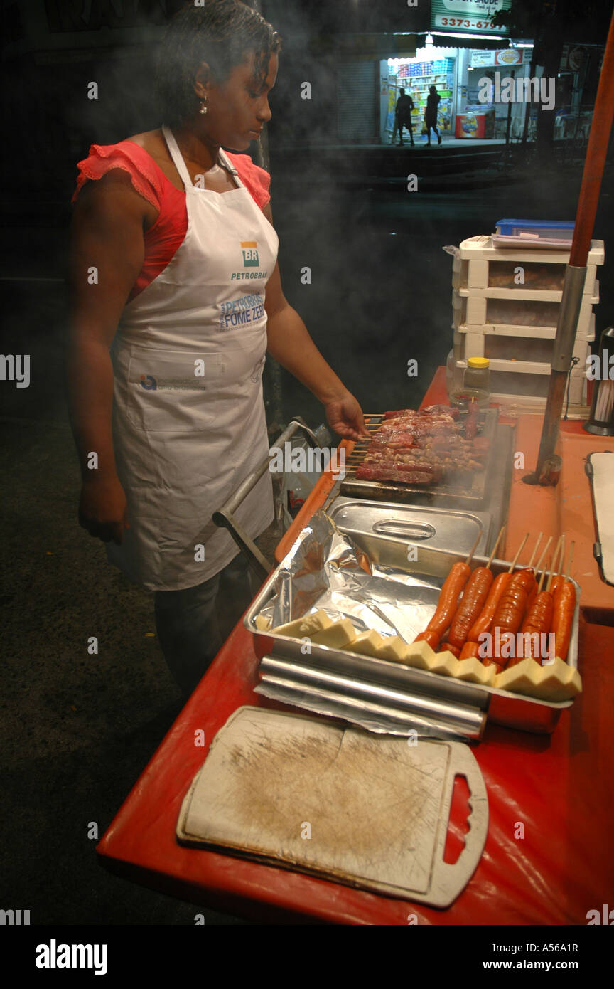 Painet iy8145 brazil niara darc cooking kebabs sausages food stall rio janeiro 2005 country developing nation less Stock Photo